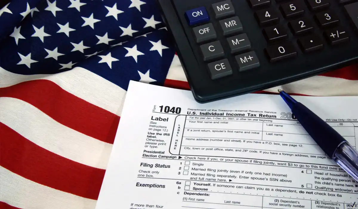 What is tax liability explained with a tax form and US flag